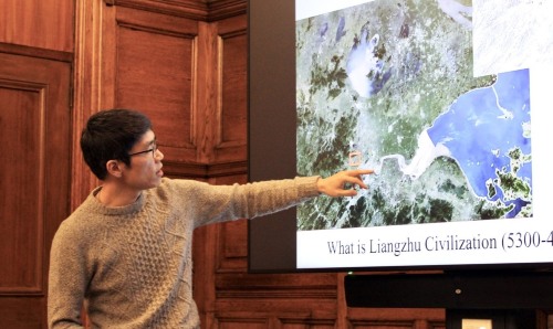 Man pointing at a presentation on Liangzhu civilisation