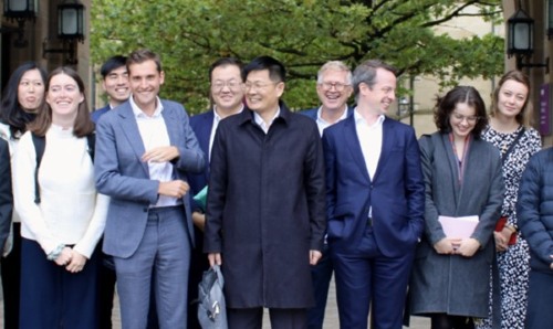 Professor Gries and diplomats outside the Old Quadrangle