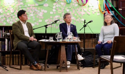 Three people sat around table at MCI roundtable event