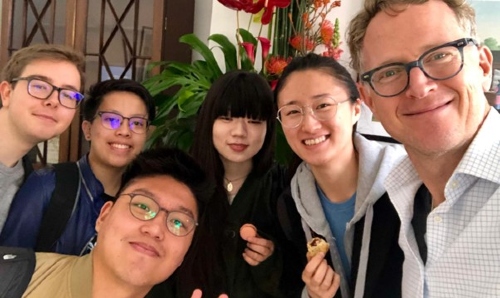 Group of six people from MCI smiling at camera