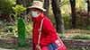 An elderly Chinese man wearing a football themed outfit